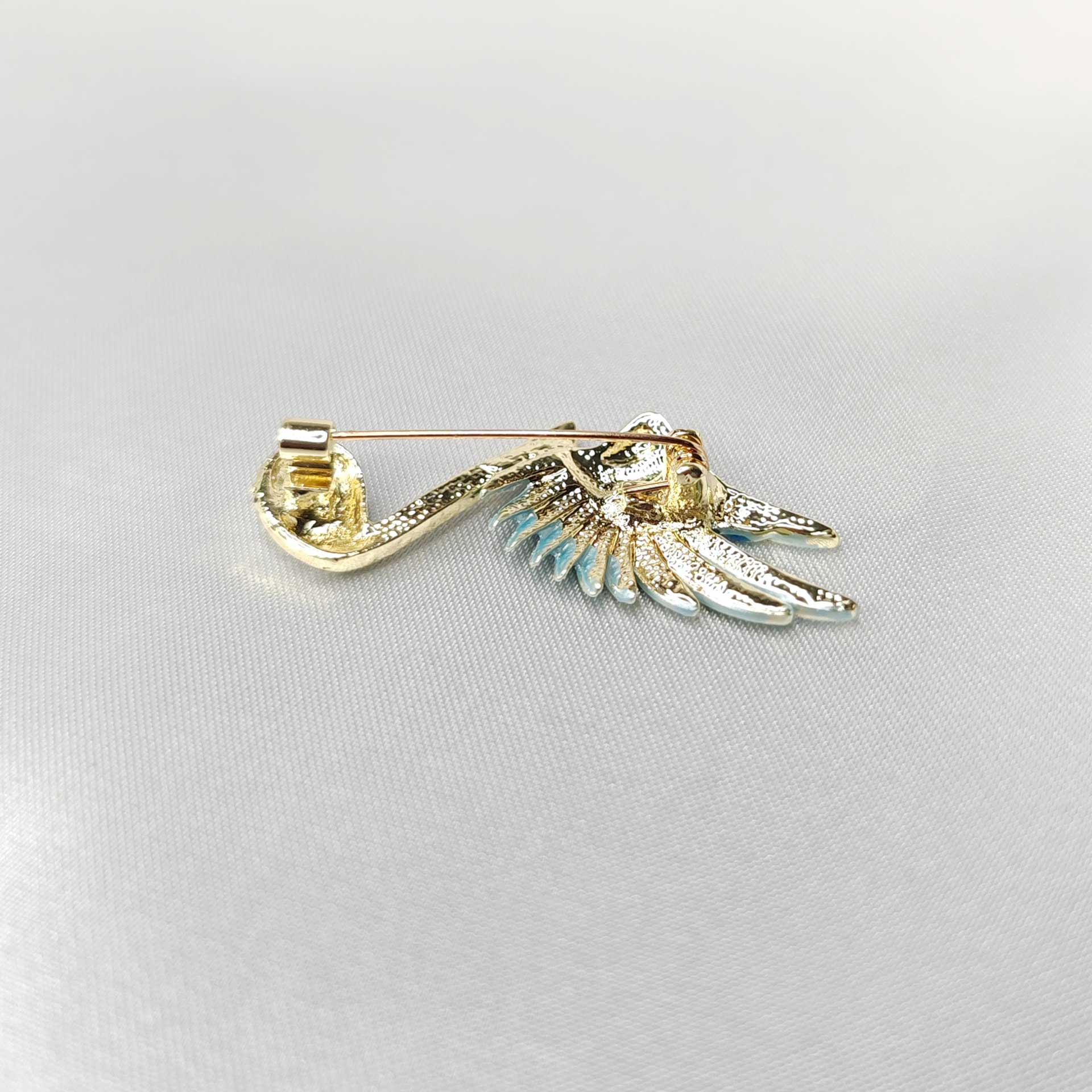 verso de la Broche bijou note musique ailée