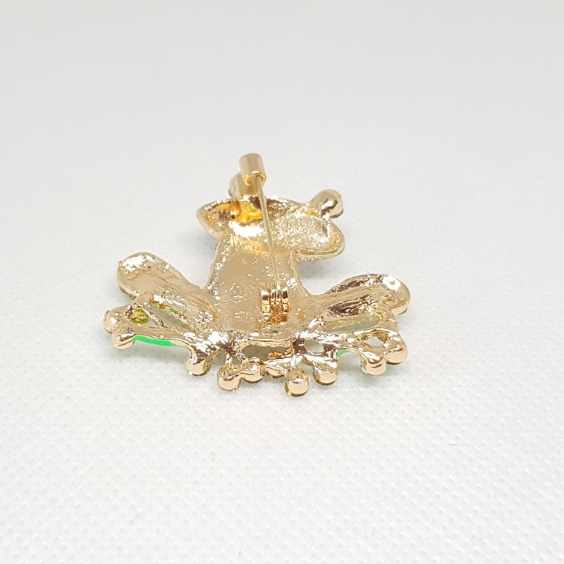 Broche Grenouille Multicolore assis vue de dessous.