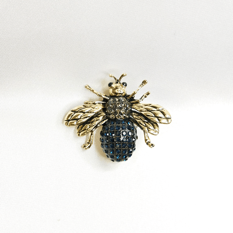 Broche abeille bleue dorée