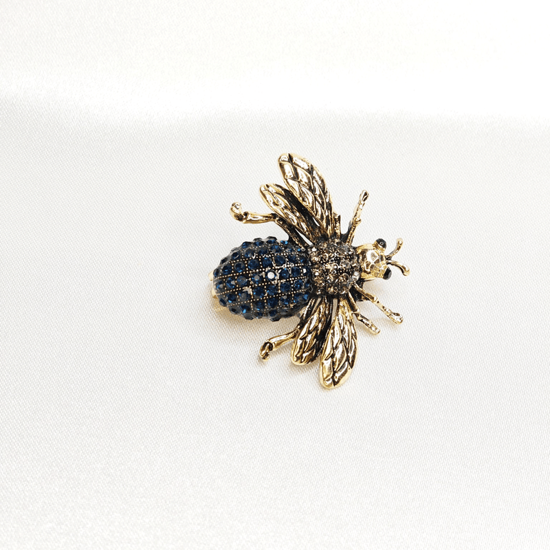 Broche abeille bleue dorée