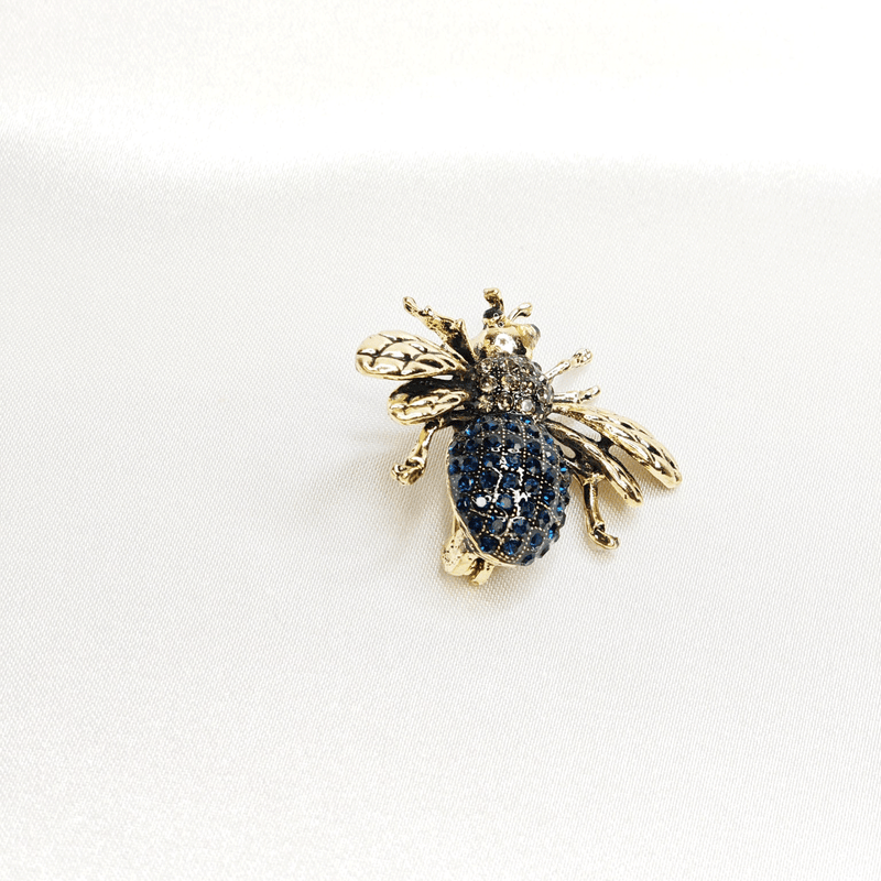 Broche abeille bleue dorée