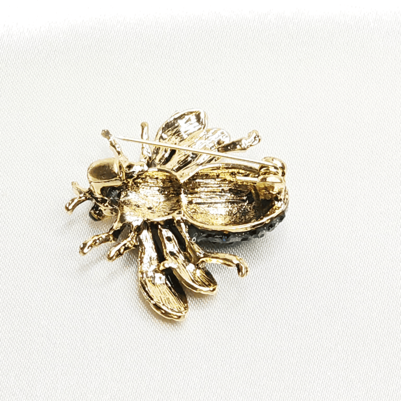 Broche abeille bleue dorée