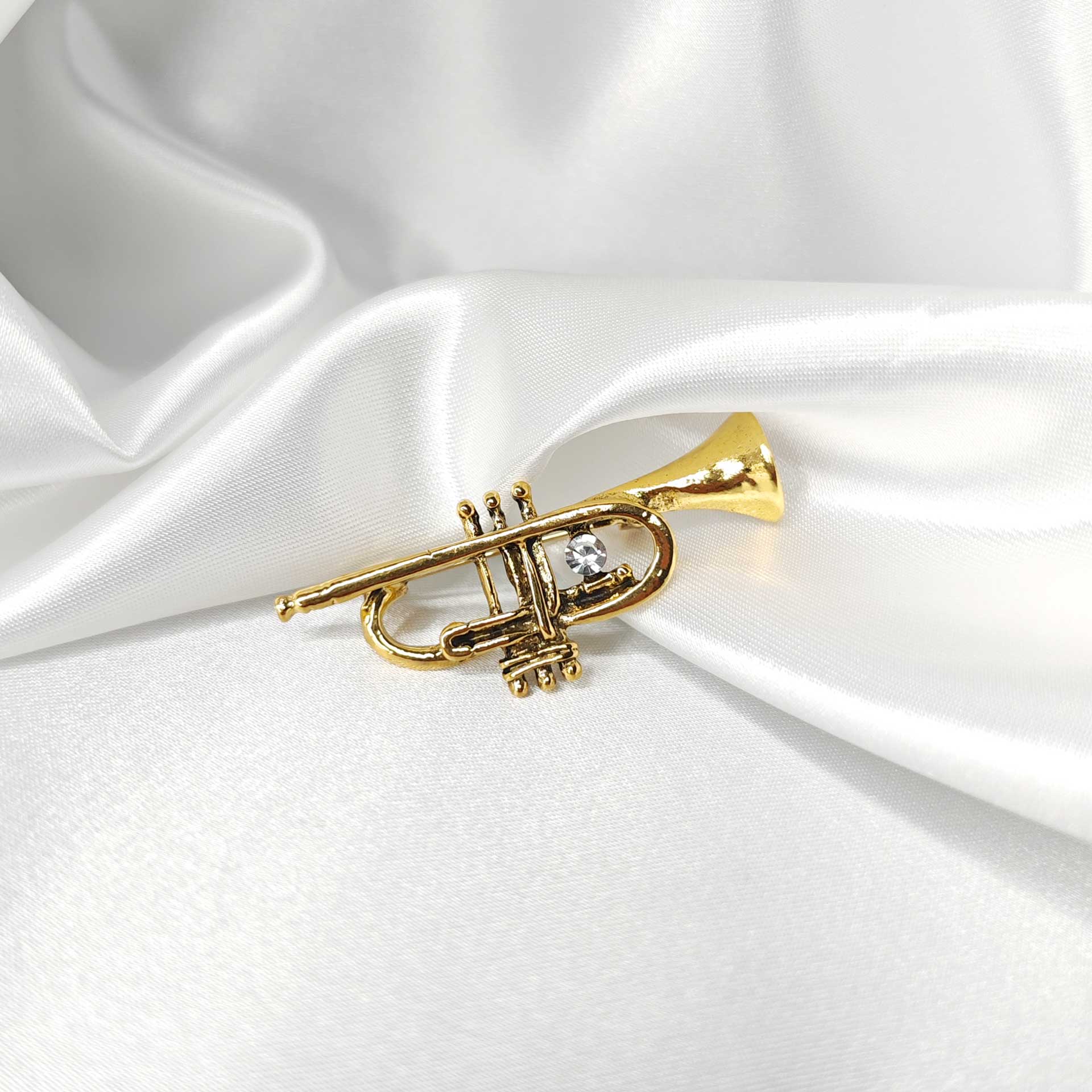 Broche bijou trompette dorée photo 1