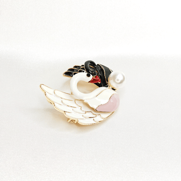 Broche double cygne noir et blanc avec perle