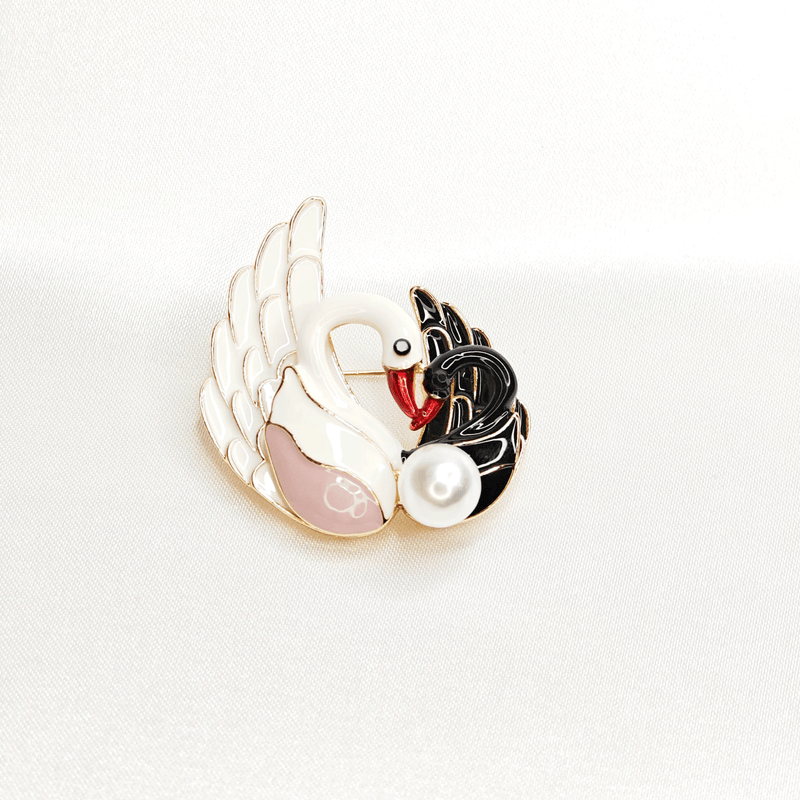 Broche double cygne noir et blanc avec perle