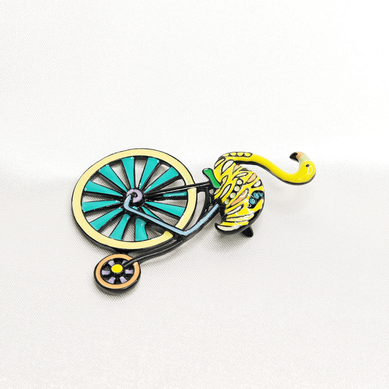 Broche flamant jaune cycliste