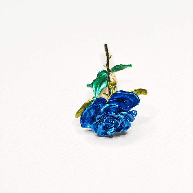 Broche rose bleue