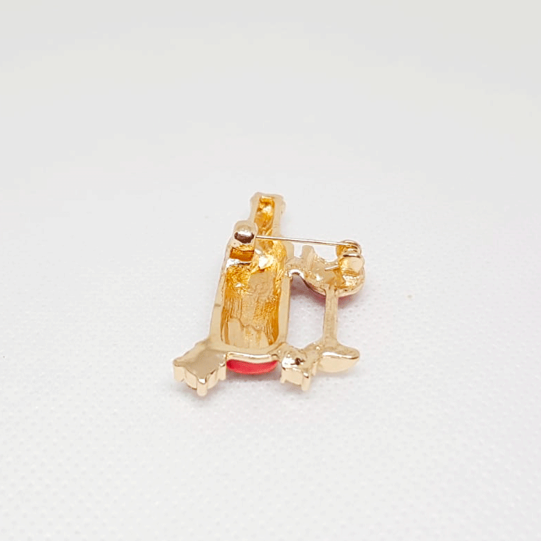 Golden Brooch Red Wine Bottle and Glass