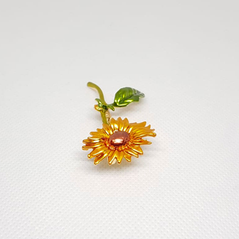 Goldene Brosche Sonnenblume Blume grünes Blütenblatt